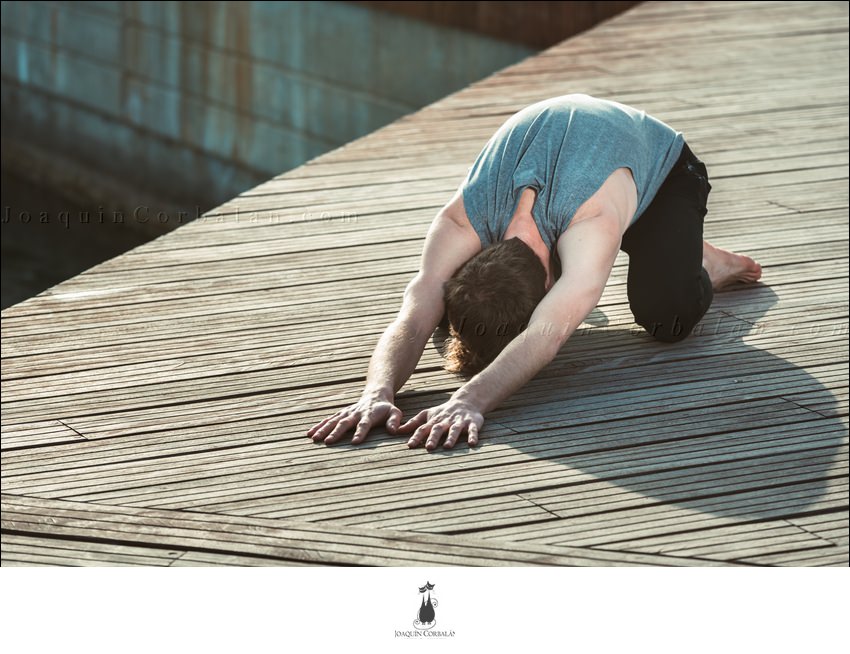 Balasana Is A Yoga Posture To Avoid Back Pain, A Young Man Practices It.