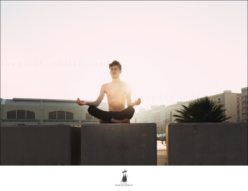 Young Man Practices Yoga To Relax From The Stress Of The City And Exercise.