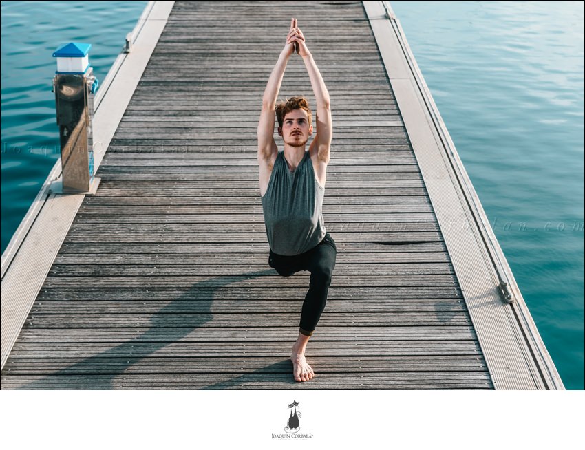 Young Man Practices Yoga To Relax From The Stress Of The City And Exercise.